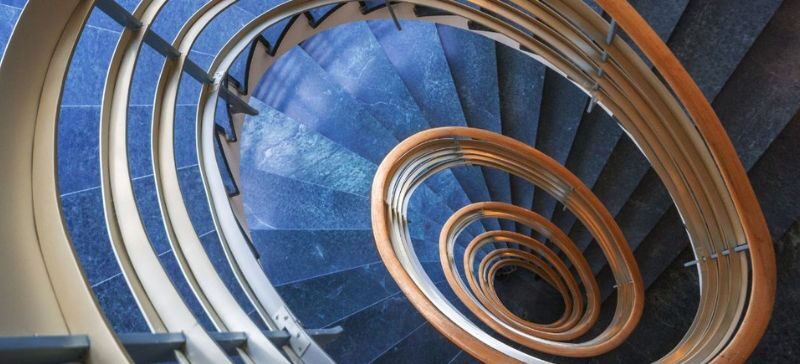 Looking down at a spiral staircase from high up