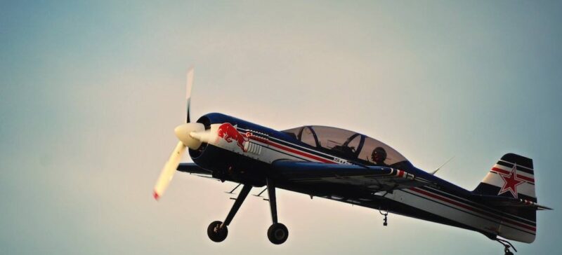 A propellor plane with the Redbull logo on it