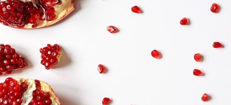 A broken pomegranate on a white background