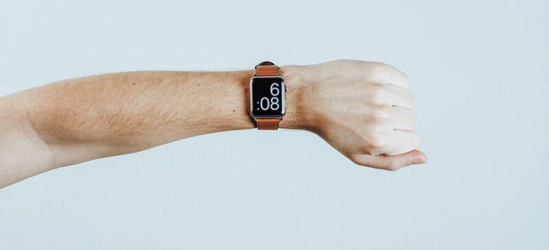 A man checking the time on his wristwatch