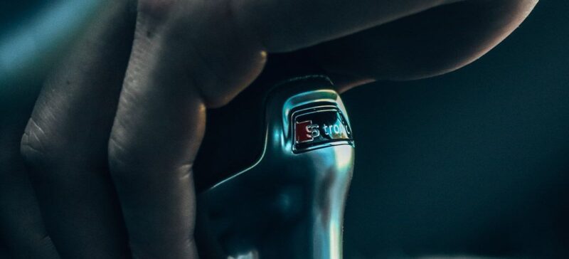 Hand on a vehicle's gear shift